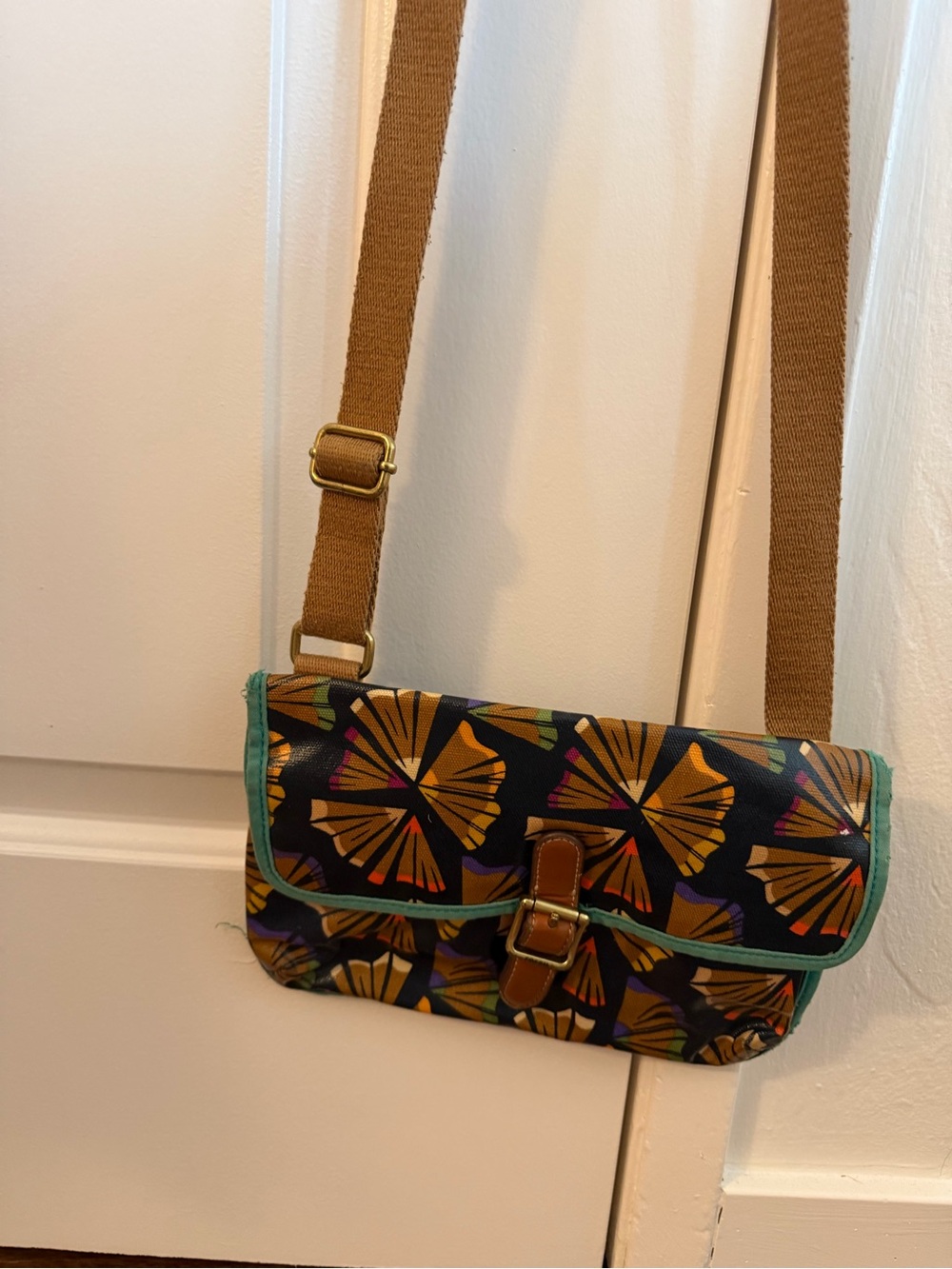 Fossil Black Crossbody with Pencil Shaving Pattern and Teal Trim